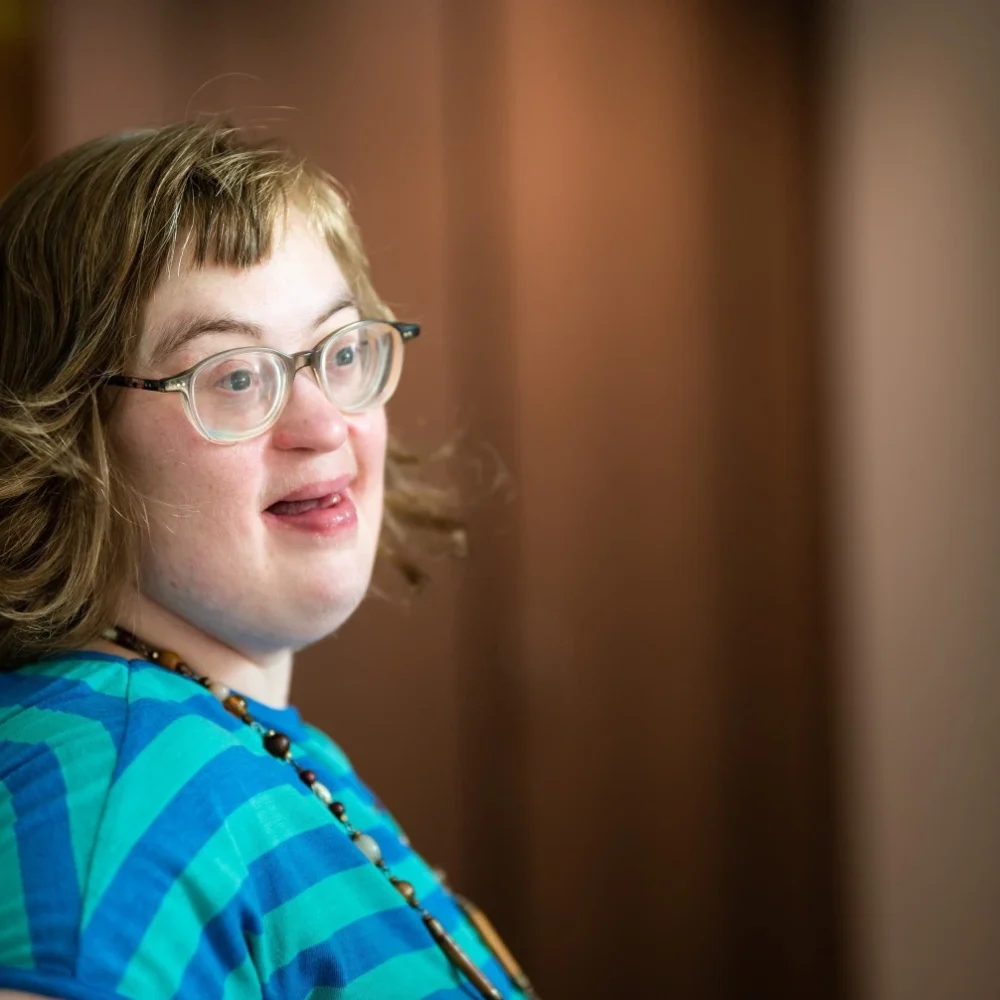 Girl with down syndrome smiling
